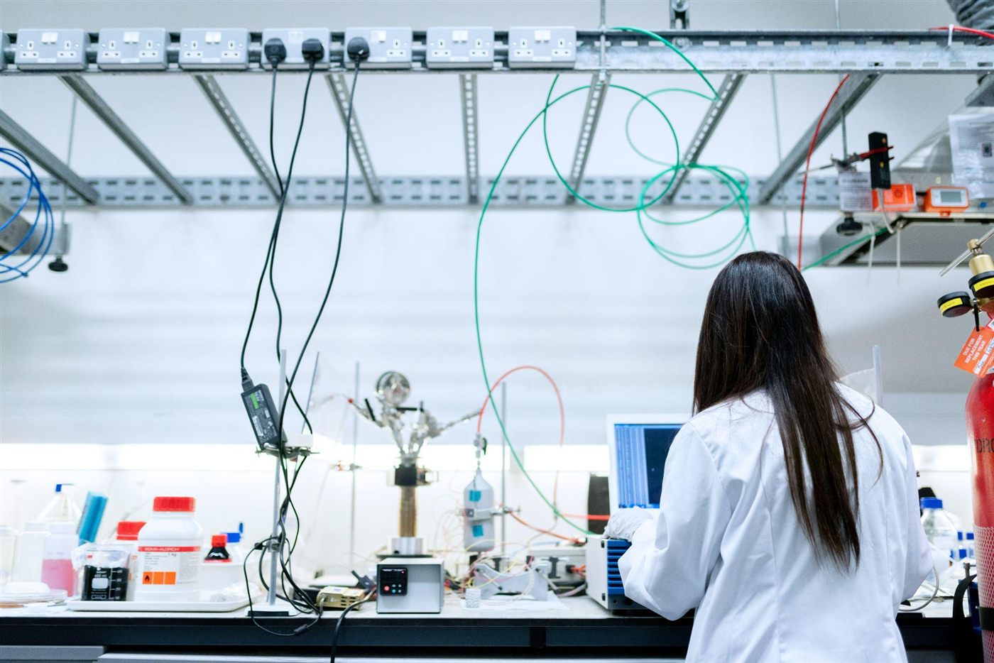 Scientist working at a laboratory instrument